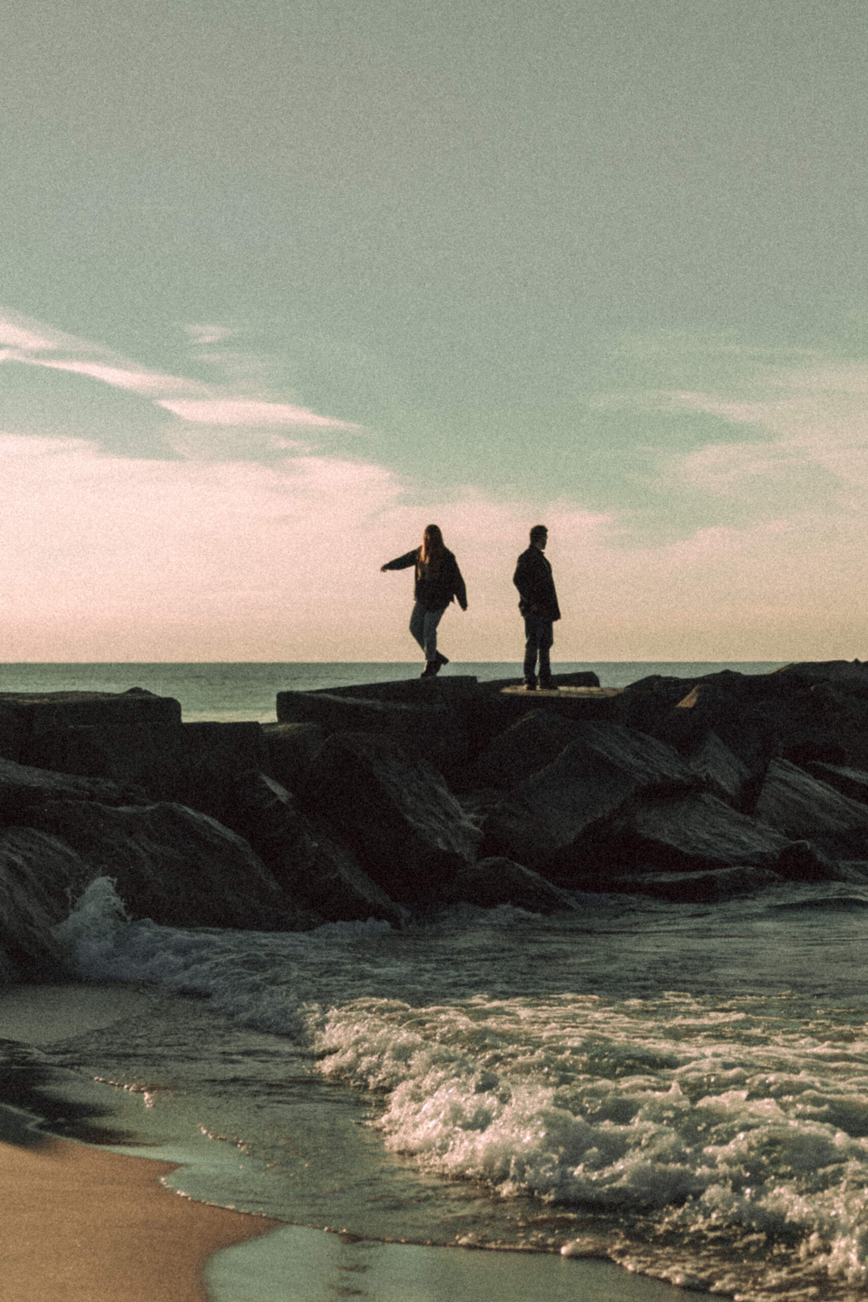 Couple walking on cliffs at Lake Michigan