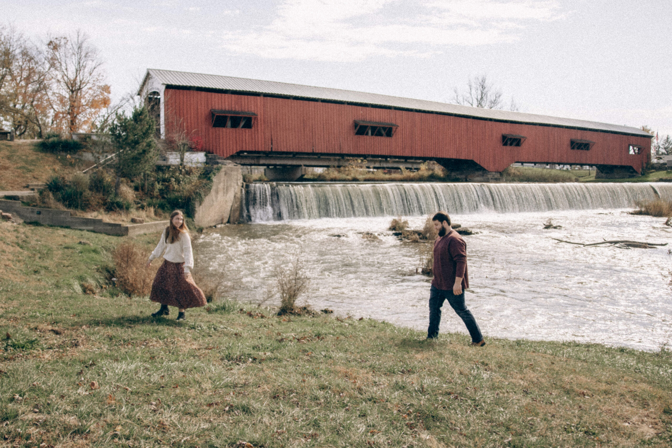 Man running after his girlfriend at Covered Bridge in Indiana