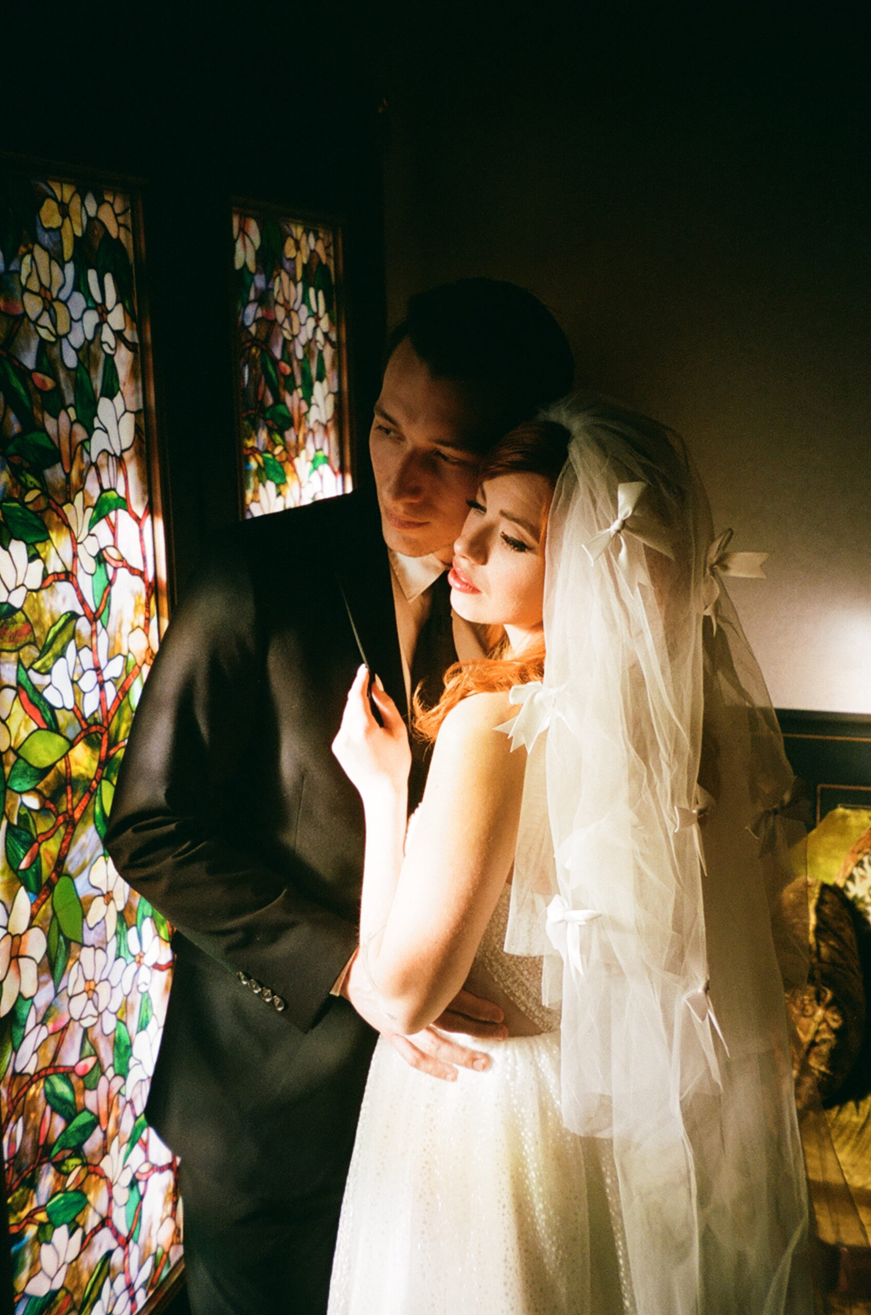 vintage 50s wedding couple looking out the window